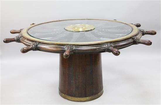 A George III brass mounted oak ships wheel from HMS Medusa, named 1775, wrecked 1798 Diam. 5ft 6in.